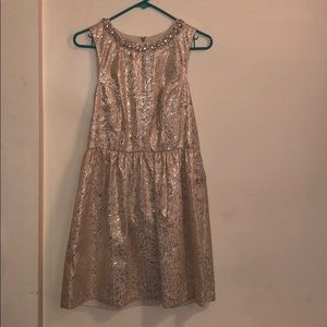 Gold and cream cocktail dress with a jewel collar.